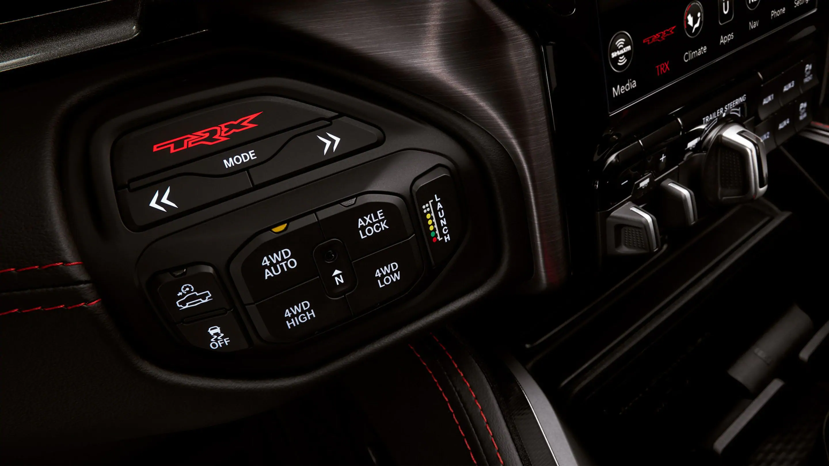 With the shifter repositioned to the center console, the Performance Control T-case switch bank now offers a host of commands from drive mode selector to Traction Control all at the driver’s fingertips.